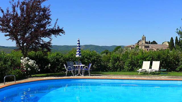 Swimming pool with a view at Villa le Barone in Tuscany 