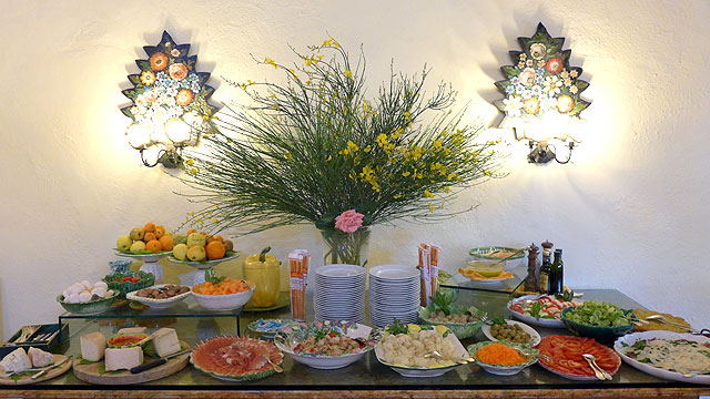 Free serving buffet table with Italian cheeses 